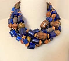 "I designed This necklace inspired by Angela Caputi Gorgeous One of A Kind !! African Wood & Blue Lucite Beads Statement Necklace Just stunning, very good condition, Five strand, hook clasp, It measure 21\" long plus 3\" chain, The pictures are part of the description so please look at all the pictures and if you have any question please feel to ask before bidding! Make sure you check out my other vintage items!" African Beads Necklace, Jewelry Wood, Earthy Jewelry, African Trade Beads, Ancient Jewelry, Wood Necklace, Beaded Statement Necklace, African Beads, Hook Clasp