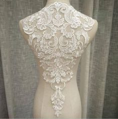 Super Luxury Lace Appliques Ivory Exquisite Lace Applique For Wedding Dress Grown Bridal Veil Bodice Size of 1 pcs : 32cm* 53cm , in inch : 12.2 * 20.4 The listing is for 1 pc. ♥It will be perfect for bowknot hairpin, baby clothes, sleeve edge, skirt edge, corsage and so on ♥Wholesale acceptable! ♥If you want more, please feel free to send me a message. I will be glad to make custom listing for you! ♥Happy shopping here sdyhttps://www.etsy.com/shop/beautyfabric Luxury Embroidered Lace For Wedding, Luxury Lace Trim Wedding Dress, Luxury Lace Patchwork Wedding Dress, Luxury Scalloped Lace For Wedding, Luxury Cream Lace For Women, Luxury Cream Wedding Dress With Lace Bodice, Luxury Romantic Lace For Wedding, Luxury Beige Wedding Corset Dress, Luxury Embroidered Lace For Ceremony