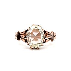 an antique diamond ring on a white background