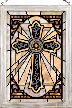 a stained glass window with a cross on it's center and an ornate design in the middle