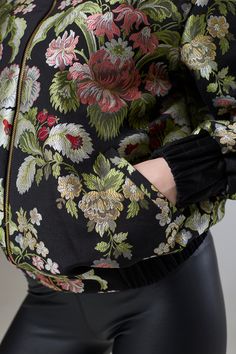 Flora Heaven Bomber Jacket  Our Flora Heaven Bomber Jacket, a heavenly fusion of botanical charm and contemporary style. This divine piece from our Bomber Jacket collection is designed to envelop you in the enchanting beauty of nature while elevating your look with its modern silhouette.  The bomber jacket silhouette offers a versatile canvas for the floral motif, with ribbed cuffs and hem adding a touch of urban edge. Whether paired with jeans for a casual day out or layered over a dress for ev Jacket Silhouette, Dress For Evening, Jacket Collection, Blazer Jackets For Women, August Birthstone Jewelry, July Birthstone Jewelry, Gifts For New Mums, Jewelry Ring Box, Pearl Jewellery Earrings