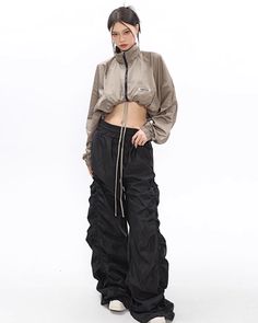 Cargo pants with a distinctive feature of generous gathers towards the hem. 

The spacious silhouette creates a street atmosphere. 

The waist is adjustable with a string, making it comfortable to wear. 

◾️Model
Height/Weight: 165cm/42kg
Try size: L





Size (cm)

Pants length
Waist
Hip


S
114
64
100


M
115
66
104


L
116
68
108 Black Techwear Parachute Pants With Drawstring, Black Parachute Pants With Drawstring, Black Stretch Parachute Pants With Drawstring, Black Wide Leg Harem Pants With Drawstring, Baggy Drawstring Parachute Pants For Fall, Baggy Parachute Pants With Drawstring For Fall, Drawstring Parachute Pants For Fall, Fall Parachute Pants With Drawstring, Fall Drawstring Parachute Pants