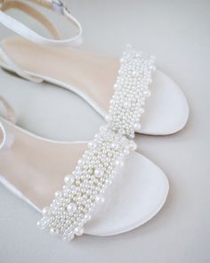 Shop our elegance collection of women & girls flat satin sandals. Perfect for flower girls, birthday party, princess costumes and other formal events. FREE SHIPPING IN U.S FOR ORDERS $100 AND MORE! Elegant Pearl Sandals For Party, Summer Open Toe Pearl Wedding Shoes, Summer Wedding Pearl Open Toe Shoes, Elegant Beaded Flat Sandals, Elegant Open Toe Pearl Wedding Shoes, Elegant Summer Wedding Shoes In Pearl White, Elegant Pearl White Wedding Shoes For Summer, Elegant Beaded Open Toe Sandals, White Pearl Open Toe Wedding Shoes