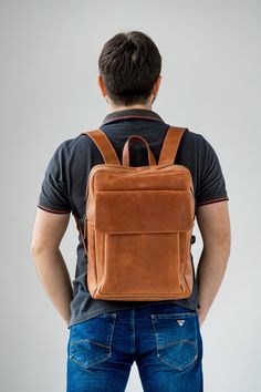 ● Large leather cognac backpack with big inside and outside pockets ● ● Large backpack is made by hand from genuine leather. Has three inner pockets and one large outer pocket with a flap. This backpack is suitable for both men and women. It can be used in everyday life for work, study, sports and travel. The backpack is made of high-quality genuine leather that guarantees its durable use.● ● Easily fits a 15.6 '' laptop in this backpack ● ● Unique leather over time gets better. A bag can be mad Leather School Backpack With Luggage Sleeve, Cognac Leather Travel Backpack, Modern Brown Backpack For Everyday Carry, Brown Standard Backpack Travel Bag, Everyday Carry Soft Leather Backpack, Leather Backpack With Luggage Sleeve, Brown Leather Backpack Functional Style, Functional Brown Leather Backpack, Brown Leather Functional Backpack