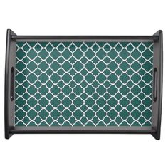 a green and white tray with an intricate pattern on it, in the shape of a trellis