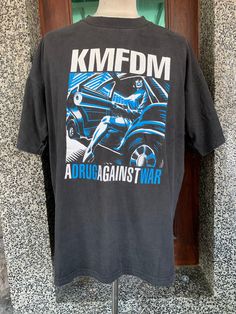 "Vintage 90s KMFDM Band T Shirt item condition : pre owned (used ) Condition : please see picture Size in tag : XL  tag  : measurement chest (Pit to pit ) 24.5\" Length 28.5 \" shipping : world wide Standard shipping : 14 - 30 days Express : 5-10 days I can do bundle/combined shipping add USD 5 shipping for each additional items" Vintage Band T Shirts, Band T Shirts, Mens T Shirts, Metal Band, Band Shirts, Mens Graphic Tee, Metal Bands, Picture Sizes, Vintage 90s