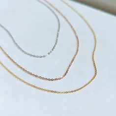 Get on trend in our simple, dainty gold cable chain necklace! Perfect by itself, layer it with another piece or add your favorite charm! ✔ Hypoallergenic ✔ Waterproof ✔ Quality Guaranteed ✔ Lifetime warranty against rust and tarnishing MATERIAL: ﻿Stainless steel dipped in real 18k gold Minimalist Delicate Chain Charm Necklaces For Layering, Minimalist Cable Chain Necklace For Layering, Rose Gold Minimalist Cable Chain Necklace, Minimalist Charm Necklaces For Layering, Minimalist Rose Gold Cable Chain Necklace, Dainty Cable Chain Necklace, Minimalist Charm Necklace With Delicate Link Chain, Simple Charm Necklace With Delicate Chain, Everyday Charm Necklace With Delicate Link Chain