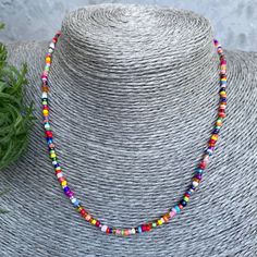 Buy a necklace handmade from beads. 🌟It is handcrafted on double thick line for durability and strength. 🌟The clasp is a carabiner clasp. 🌟The beads are tiny, each necklace is unique in its own way. It is possible to choose the length. 🎁 As a gift you get a storage bag :) Colorful Beaded Adjustable Necklaces, Multicolor Letter Beads Necklace For Festival, Festival Necklace With Round Letter Beads, Colorful Adjustable Necklaces With Round Beads, Colorful Letter Beads For Festival, Colorful Adjustable Beaded Chain Necklace, Handmade Heishi Oval Beads, Colorful Heishi Beads For Festival, Colorful Letter Beads Necklaces For Jewelry Making