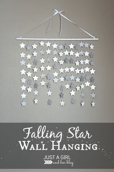 falling star mobile hanging on the wall with text overlay that reads falling star mobile