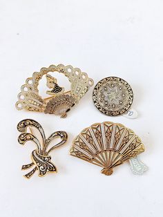 These are 20s 30s antique Spanish fan Damascene brooches from Toledo, Spain, and a pair fan screw back earrings. They are all unused from an old shop which closed. They are all in perfect or almost perfect condition in the front, and a few of them have spots of fading in the back. Sets are priced including a discount. PLEASE CHECK PICTURES AND DESCRIPTION FOR DETAILS. Toledo gold is an ancient Spanish tradition is done by hand inserting 24K gold inlays and other precious metal into non precious Spanish Fan, Toledo Spain, Gold Locket Necklace, Cameo Earrings, Heart Locket Necklace, Gold Locket, Fan Earrings, Pearl Choker Necklace, Photo Locket