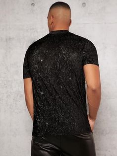 This Men's Black Mesh Crewneck Sequin Short Sleeve Shirt features lightweight mesh fabric and a shimmery sequin pattern for a unique and stylish look. The construction is breathable and comfortable, making it a great choice for warm-weather days. 100% Poly Imported Pull On closure Hand Wash Brand Size Chest Waist S 43.7 40.6 M 45.7 42.5 L 48.7 45.5 XL 51.7 48.5 XXL 54.6 51.5 Fitted Sequin T-shirt For Summer, Black Stretch T-shirt For Party, Summer Party Shirt With Stretch, Stretch Summer Party Shirt, Summer Party Stretch Shirt, Fitted Black T-shirt For Party, Party Season Sequined Crew Neck T-shirt, Party Crew Neck Top With Contrast Sequin, Black Tops With Contrast Sequin For Summer