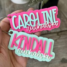 two pink and green name tags with the words carpo line, kndall & krussel on them