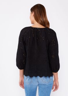 A classic cotton bohemian blouse with embroidered eyelet details. Embroidered eyelet Relaxed fit 3/4 length sleeve Button cuff closure Split v-neckline with ties Scalloped hem Not lined Bohemian blouse An ultra-charming cotton blouse for summer! Tackle the heat wave with our comfortable yet stylish embroidered eyelet top, designed with an unlined fabric for an airy and breezy feel. Featuring 3/4 length sleeves, button cuff closure, and a split v-neckline with ties. We like to pair this effortles Bohemian Blouse, Eyelet Blouse, Bohemian Blouses, Scallop Hem, Bohemian Tops, Eyelet Top, Cotton Blouse, Shoes With Jeans, Scalloped Hem