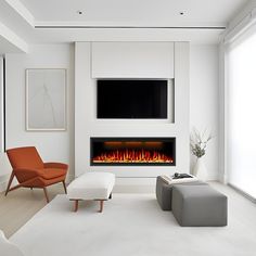 a modern living room with a fireplace and tv above the fire place in the wall