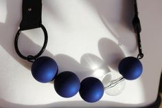 A beautiful necklace made of large- 3 cm beads, blue bead balls look tactilely like soft touch rubber, a transparent acrylic bead that reflects light and visually interrupts the line of their blue beads perfectly match with black rubber with a thickness of 25 mm.  The necklace does not have a clasp and is worn over the head. At your request, I can extend the rubber band, as well as put a magnet fastener.  The length of the necklace reaches about the middle of the chest. The size of my "assistant Asymmetrical Jewelry, Mesh Jewelry, Asymmetrical Necklace, Mesh Necklace, Red Necklace, Unusual Jewelry, Bib Necklaces, Black Choker, Modern Necklaces