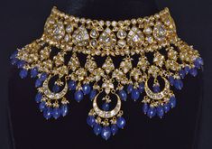 VINTAGE ASIAN LARGE 22K 18K GOLD TANZANITE, DIAMOND AND SEED PEARL CHOKER NECKLACE / EARRINGS SET !!THIS LISTING IS OF THE NECKLACE AND MATCHING EARRINGS!! GORGEOUS UNTREATED NATURAL DIAMONDS, NATURAL SEED PEARLS AND NATURAL TANZANITES EXTREMELY HIGH END - TOP QUALITY SET THIS IS AN ABSOLUTELY GORGEOUS LARGE BRIDAL CHOKER SET, STUDDED WITH NATURAL UNCUT DIAMONDS THROUGHOUT ACCENTED WITH HANGING GOLD LINKS / DROPS SET WITH MORE DIAMONDS. THE NECKLACE AND CHANDELIER EARRINGS HAVE BEAUTIFUL LARGE T Opulent Hallmarked Wedding Jewelry, Luxury Gold Kundan Necklace With Meenakari, Luxury Gold Meenakari Bridal Necklace, Luxury Gold Jewelry With Meenakari, Luxury Gold Meenakari Jewelry, Luxury Gold Bridal Necklace With Stone Work, Luxury 22k Gold Jewelry For Festive Season, Luxury 22k Gold Festive Jewelry, Festive 22k Gold Luxury Jewelry