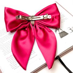 Experience royal elegance in Miss Me's Layered Bow with Pearl Center! The layered design and pearl center create a timeless look, perfect for any special occasion. This bow measures 7 1/2 inches long and 6 1/2 inches wide. SKU: #0430-2408 Elegant Red Bow For Gift, Chic Party Hair Accessories With Satin Bow, Chic Bow Hair Accessories For Party, Chic Party Hair Accessories With Bow, Chic Formal Hair Accessories With Satin Bow, Elegant Pink Hair Accessories For Wedding, Elegant Pink Wedding Hair Accessories, Pink Bow Tie With Detachable Bow For Party, Elegant Evening Hair Accessories With Decorative Bow