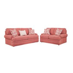 two red couches with pillows on them