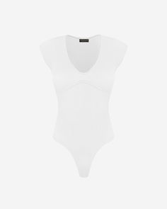 Experience comfort and style with our Ryder Ribbed Bodysuit. Made with a soft interior, this bodysuit is perfect for layering or wearing on its own. With its snap button closure and V-neckline, this bodysuit is easy to wear and style. The stretchy material and thong fit make it a perfect choice for layering under your favorite outfits. The seam detail on the chest adds a touch of sophistication to this versatile piece. Dress it up with a skirt for a night out, or pair it with jeans for a more ca Summer V-neck Ribbed Bodysuit, Solid Loungewear Bodysuit With Lined Body, Lined Loungewear Bodysuit In Solid Color, Solid Color Loungewear Bodysuit With Lined Body, Solid Ribbed V-neck Bodysuit, Solid Color Ribbed V-neck Bodysuit, White V-neck Bodysuit For Loungewear, White Ribbed Bodysuit For Loungewear, White Second-skin Bodysuit With Lined Body