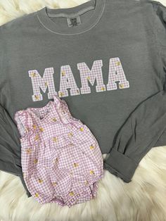 Seriously obsessed! The perfect way to hold those baby outfits close to your heart. You will ship us your outfit(s) and we will use those as the fabric for the MAMA print.  ❤️  Ordering process: 1. Complete order details in personalization box and drop downs 2. Place Order 3. You will receive our address for shipment within 24 business hours of purchase, if purchased on the weekend it will be sent Monday  4. Mail outfit(s) - PLEASE KEEP tracking number as we are unable to individually check for Cute Long Sleeve T-shirt With Embroidered Text, Matching Spring Loungewear Tops, Spring Loungewear Matching Tops, Family Matching Cotton Tops For Spring, Family Matching Cotton Tops For Loungewear, Family Matching Soft-washed Cotton Tops, Matching Cotton Tops For Loungewear, Cotton Tops With Embroidered Graphics For Loungewear, Cute Long Sleeve Embroidered T-shirt