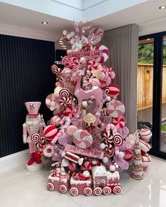 a christmas tree made out of candy and lollipops