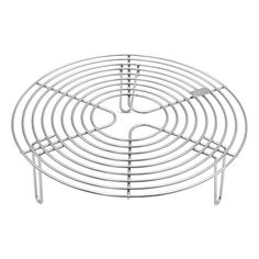 a round metal rack with four legs and two holes on each side, for cooking