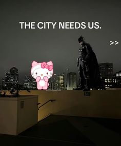 a man standing on top of a roof next to a pink hello kitty