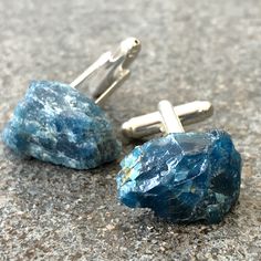 "Blue Apatite Cufflinks. Raw Stone, men's blue cufflinks. In need of \"something blue?\" Have we ever got the stone cufflinks for you! Please read on for important info * Stones average ~1.5cm at their largest point. * Natural, un-dyed, un-treated stones * Stone Origin: Minas Gerais, Brazil. Sourced from Tucson Gem Show * Silver electroplate over copper cufflinks. * Secure, easy-to-use, bullet-back hardware * Silver electroplate over copper cufflinks * Each is securely attached with aircraft gra Blue Cufflinks, Stone Cufflinks, Father Of The Bride Gift, Gift For Groom, Tucson Gem Show, Best Man Gift, Gem Show, Securely Attached, Cufflinks Wedding