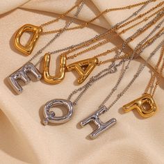 Add some playful personalization to your summer wardrobe with our Bubble Letter Necklace! This quirky accessory is a perfect gift for her, adding a fun touch to any outfit. Layer it up for a fun #neckmess! DETAILS & SIZE Finish: 18K gold plate Materials: 316L Stainless Steel Measurements: Pendant: 19.4x14.4mm; Chain: 16" + 2" extension Lobster claw clasp Waterproof, tarnish-resistant, and nickel free. Shop Necklaces for more options! Trendy Silver Necklace For Birthday, Trendy Silver Necklaces For Birthday, Trendy Customized Gold Charm Necklaces, Trendy Party Necklaces For Mother's Day, Trendy Mother's Day Party Necklaces, Trendy Gold Charm Necklaces For Personalized Gift, Trendy Party Necklace For Mother's Day, Trendy Gold Necklaces For Personalized Gift, Trendy Initial Necklace For Gift