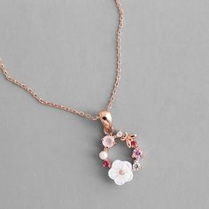 The butterfly is a deep and powerful representation of new life and reinventing yourself. Flaunt your whimsical charm in our Butterfly Pink Multi-Stone Rose Gold Necklace which shows off a stunning grouping of CZ stones in shades of pink, a sweet pearl, a gorgeous hibiscus resin flower and lovely rose gold butterfly which sits delicately in a circular shape. DETAILS & SIZE Composition: rose gold plated over copper; 3-7mm CZ crystals, 4mm faux pearl, 8mm resin flower, 6mm rose gold butterfly Floral Necklace Jewelry, Pendent Design, Beaded Jewelry Necklaces, Rose Gold Flower, Romantic Jewellery, Vintage Style Jewellery, Flower Pendant Necklace, Floral Necklace, Circle Necklace