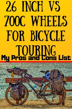 a bicycle parked on top of a wooden bench next to the ocean with text reading 26 inch vs 700c wheels for bicycle touring my pros and bikes list