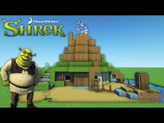 shrek is standing in front of a small building with a giant green head