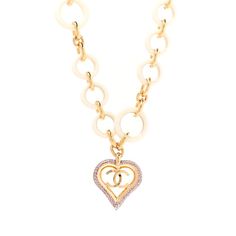 This is an authentic CHANEL Pearl Crystal Resin CC Heart Necklace in Pink, Gold, and White. This stylish necklace is just below the collar and crafted with a white resin chain and features a heart with a CC logo encrusted with pink crystals. Luxury White Chain Necklace Gift, Luxury White Chain Necklace For Gift, Luxury White Chain Necklace As Gift, Luxury White Jewelry With Adjustable Chain, Luxury White Chain Necklace With Adjustable Chain, Elegant White Heart Necklace With Chain, Luxury White Necklace With Chain Detail, White Heart Necklace With Chain, Heart-shaped White Chain Necklace For Gift