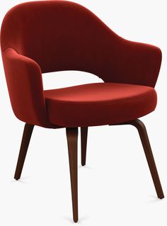 an upholstered red chair with wooden legs and arm rests on a white background