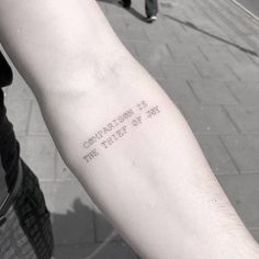 a person with a tattoo on their arm that says congratulations is the thief of my heart