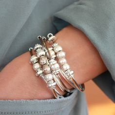 Elegant and timeless, the Bella Silver and Leather Wrap Bracelet is a luxurious combination of two supple leather strands and a mix of goldplate and silver plate metal beads. This classic piece can be customized and is so versatile it can be worn as both a bracelet and a necklace, making it an ideal Mother's Day gift. The two leather strands are also tiered (1 strand slightly longer), providing a chic look around the neck. Having two different length strands does not impact how the wrap looks wh Jewelry Accessories Bracelets, Convertible Jewelry, Wrapping Stones, Wrap Bracelet Tutorial, Bracelets Bead, Clothing Closet, Boot Jewelry, Wrap Bracelets, Silver Jewels