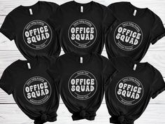 Unite your administrative squad with our Office Squad shirts, designed to foster team spirit and camaraderie in the workplace. These office team t-shirts are the perfect choice for your entire staff, providing a stylish and cohesive look while celebrating teamwork and dedication. Whether it's for daily wear or special team events, these group shirts make a thoughtful and meaningful gift for your hardworking administrative staff, showing appreciation for their invaluable contributions to the offi Black Team Spirit T-shirt With Branding, Branded Short Sleeve T-shirt For Team Events, Custom Logo T-shirt For Team Events, Black Branded T-shirt For Team Events, Cotton T-shirt With Branding For Team Events, Office Team, Office Staff, Team Events, Squad Shirt