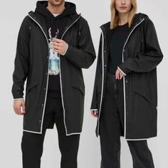 Unisex And Oversized Rains Jacket. Uninsulated, Made Of Solid Material. - Straight Fit. - Non-Detachable Drawstring Hood. - High Collar. - Fastened Outer Slip Pockets. - Reflective Elements Increase Visibility And Safety After Dark. - Snap Fastening. - Stretch Fabric. - Fine Fabric. Composition: Basic Material: 100% Polyester Coverage: 100% Pu Oversized Black Casual Raincoat, Casual Oversized Black Raincoat, Modern Black Spring Outerwear, Black Oversized Long Sleeve Raincoat, Oversized Black Raincoat With Long Sleeves, Modern Long Sleeve Raincoat For Spring, Modern Black Winter Raincoat, Dark Snap, Rains Jacket