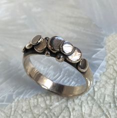 Description: A lovely unisex hammered dots sterling silver band K#673 Dimensions: Approximately width - 5mm to 3mm approx. Size: 8 *If, for any reason, you are not completely satisfied, please contact me so we can try to work out the problem. Shipping I ship twice a week. pls allow few days before shipping. Wide Silver Band, Agate Stone Necklace, Cocktail Necklace, Silver Gold Earrings, Wide Silver Ring, Chunky Silver Rings, Sparkly Ring, Chunky Ring, Textured Ring