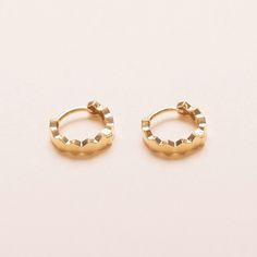 "Introducing our elegant Hexagon Hoops earrings, a dazzling addition to your jewelry collection. Crafted with precision and style, these exquisite earrings are made from 10k solid gold, ensuring a lasting and luxurious piece. - Materials: 10K solid yellow gold - Measurement: approximately 0.31\" / 8mm in diameter, and the width of the band is about 0.12\" / 3mm - The product is made to last forever. Solid gold will not oxidize or discolor - Contact us sales@shapesstudionyc.com for custom orders" Elegant Octagon Hoop Earrings As Gift, Minimalist Huggie Earrings With Diamond Cut, Yellow Gold Octagon Earrings With Diamond Cut, Modern Yellow Gold Octagon Earrings, Modern Octagon Yellow Gold Earrings, Gold Octagon Diamond Cut Earrings, Minimalist Small Hoop Diamond Cut Earrings, Elegant Hexagon Hoop Earrings As Gift, Minimalist Gold Octagon Earrings