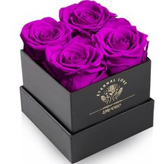 a black box with purple roses in it