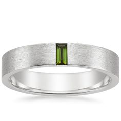 Men's Platinum Apollo Green Tourmaline Wedding Ring. This modern wedding band features a vertical baguette green tourmaline set in a matte brushed finish for a defining look. The softened inside edge provides increased comfort for daily wear. Green Platinum Wedding Rings, Green Platinum Rings For Wedding, Luxury Timeless Men's Ring With Baguette Cut, Classic Green Platinum Rings, Green Baguette-cut Platinum Jewelry, Modern Wedding Band, Green Tourmaline Ring, Platinum Wedding Rings, Brilliant Earth