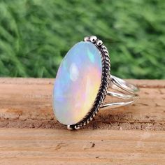 Welcome to Our Shop. Product Details Stone: Natural Gemstone Ring Shape: Oval This One of a kind ring is adorned with beautiful rich Ethiopian opal Gemstone set in sterling silver band. About gemstone- Ethiopian opal is associated with various Moon Goddesses .Moonstone has a very strong connection to the spiritual world. It has great nurturing energy which will give ease and guide in difficult times especially in issues related to love and family. It helps in banishing our own negativity It enco Moon Goddesses, Love And Family, Ethiopian Opal Ring, Zierlicher Ring, Natural Gemstone Ring, Difficult Times, Ring Antique, Ring Boho, Boho Ring