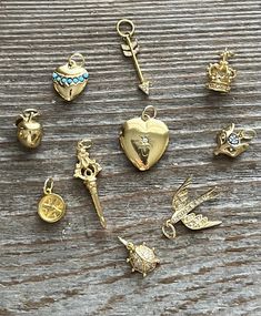 These are retired charms from a charm necklace. The stones are CZ and the gold vermeil is bright with no loss. I have added sturdy gold filled jump rings. They have all stones intact. All charms are 3D and sparkle! Gold Round Pendant Charm With Lobster Clasp, Gold 14k Round Pendant Charms, Heart-shaped Gold Jewelry With Vintage Charm, Yellow Gold-plated Charms With Lobster Clasp, Gold Round Pendant Charm In 14k, Anniversary Jewelry With Removable Heart Charms, Gold Dainty Necklaces With Removable Charms, Gold Dainty Necklace With Removable Charms, Gold-tone Round Charm Necklaces