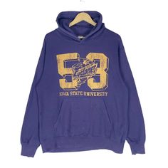 PLEASE ASK ANY QUESTION BEFORE BUYING THIS IS USED CLOTHING PLEASE DONT EXPECTED IT TO BE LIKE NEW OR IN PRISTINE CONDITION Vintage 90s IOWA State University Hoodie Cyclones NFL Sweatshirt Crewneck Purple Colour Football Size Large tag U.S College material Cotton 100% saiz on tag L (Large) Mesasures About ( Approximately) -Armpit to Ampit : update inch -Length (back collar down) : updated inch Condition : used good condition 8/10 **No Tears No Stains And No Hole** 🎈PLEASE READ THE DESCRIPTION A Oversized Vintage Hoodie For College, Collegiate Long Sleeve Graphic Hoodie, Collegiate Hoodie Sweatshirt With Logo Print, Collegiate Logo Print Hoodie Sweatshirt, Collegiate Style Hoodie Sweatshirt With Logo Print, Vintage College Hoodie Tops, Throwback Long Sleeve Hoodie For College, Vintage Sports Hoodie With Graphic Print, Collegiate Hoodie With Graphic Print