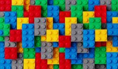 many different colored legos are arranged in the shape of an abstract wallpaper pattern