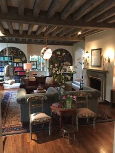 a living room filled with furniture and a fire place