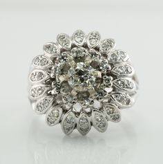 Genuine Diamond Ring, 14K Gold Ring, Vintage Ring, Cocktail Ring, Natural Diamond Cluster Ring, Flower Ring, 1930's Ring. * For all items above $1500, a telephone number is required for shipping. International buyers contact us first before purchase.* This amazing circa 1930s vintage floral ring is finely crafted in solid 14K White Gold (carefully tested and guaranteed). The center old mine cut diamond is .45 carat of VS2 clarity and J color. It is surrounded by 10 single cut diamonds = .12 cara Vintage Brilliant Cut Cluster Diamond Ring, Vintage Brilliant Cut Flower Ring For Formal Occasions, Vintage 14k White Gold Hallmarked Rings, Vintage Flower Ring With Brilliant Cut For Formal Occasions, Estate Jewelry Ring With Center Stone, Vintage Diamond Flower Ring For Formal Occasions, Vintage 14k White Gold Rings With Rose Cut Diamonds, Art Deco White Gold Cluster Ring With 17 Jewels, Estate Style Diamond Ring With Center Stone