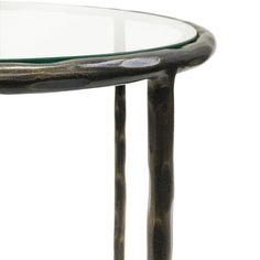 a glass top table with metal legs and a round glass tabletop on the bottom