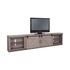 an entertainment center with sliding doors and a flat screen tv mounted on it's side